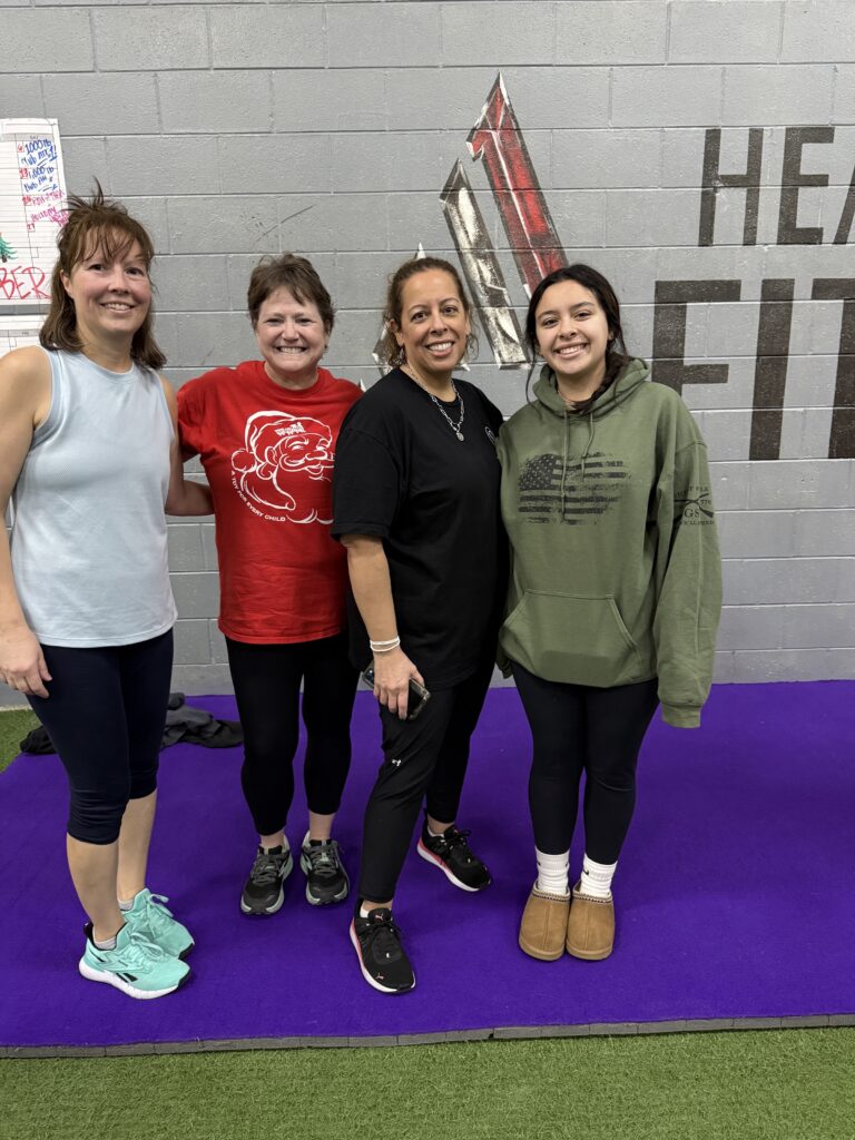 Four participants smiling at last year's Row-A-Thon